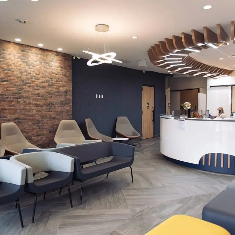 Reception area of South Calgary Oral Surgery, featuring modern decor and comfortable seating.